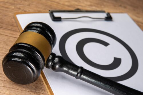 Close Up Of A Judge S Gavel Placed Beside A Copyri 2026 01 11 10 50 49 Utc